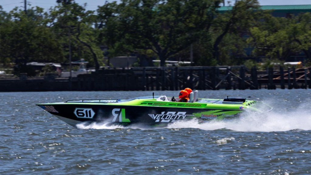 High-speed green and black powerboat racing across water at Thunder on Cocoa Beach 2026 IHRA Championship.