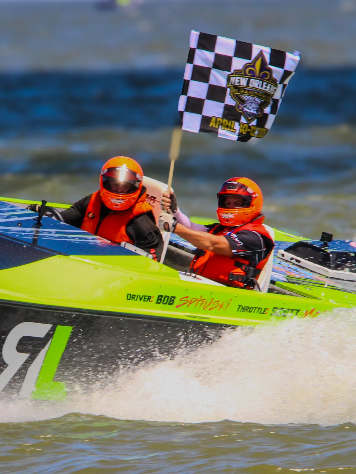 Bob Spitulski and Scott McCormick taking the chequered flag aboard the #611 Velocity Ride Legal offshore powerboat at the New Orleans Grand Prix